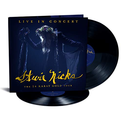 Vinyl record sleeve with Stevie Nicks on stage, holding a microphone, with two vinyl records.