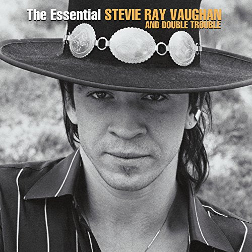 Black and white portrait of Stevie Ray Vaughan wearing a cowboy hat.