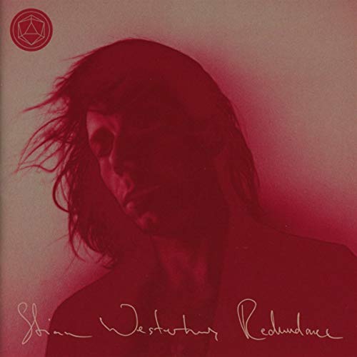 Album cover with a red-tinted portrait of a man with flowing hair.