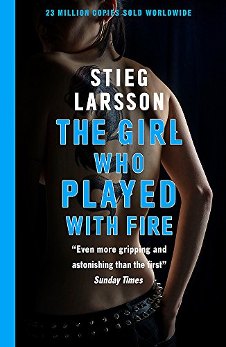 Book cover featuring a topless woman with tattoos, dark background, and blue accents.