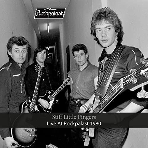 Black and white photo of Stiff Little Fingers, 1980, with instruments.