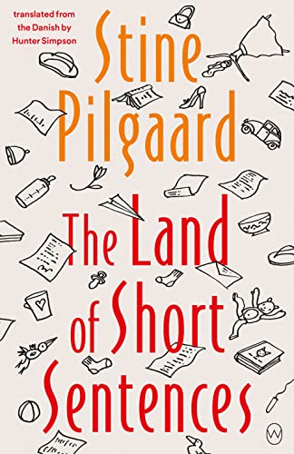 Book cover with title “The Land of Short Sentences” and scattered line drawings.