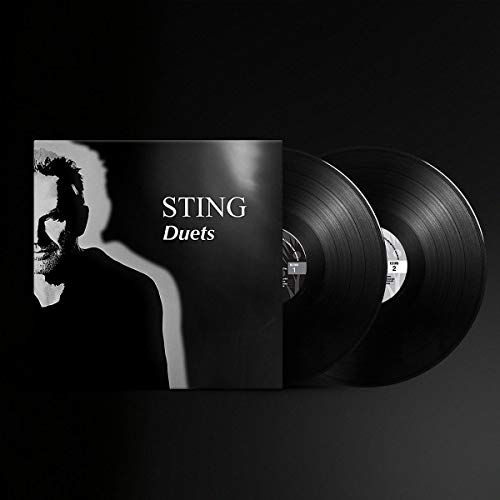 Sting Duets album cover and two black vinyl records against a dark background.