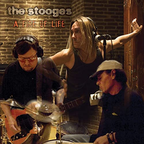 The Stooges album cover featuring Iggy Pop and bandmates in a studio.