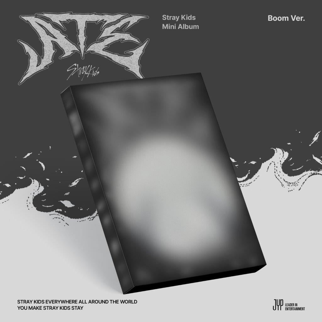 Black album case for Stray Kids ATE Boom Version against a greyLC greyLC grey background.