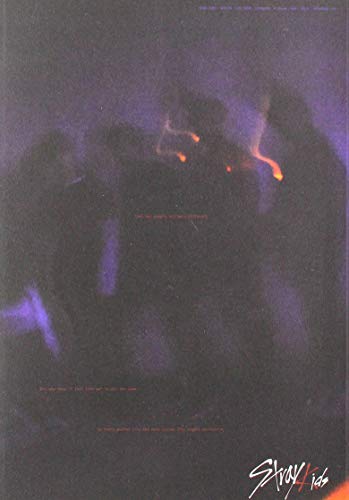 Stray Kids album cover: dark, smoky figures with glowing orange eyes.
