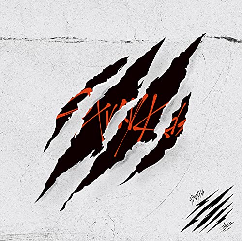 Stray Kids album cover: black claw marks over red text on white.