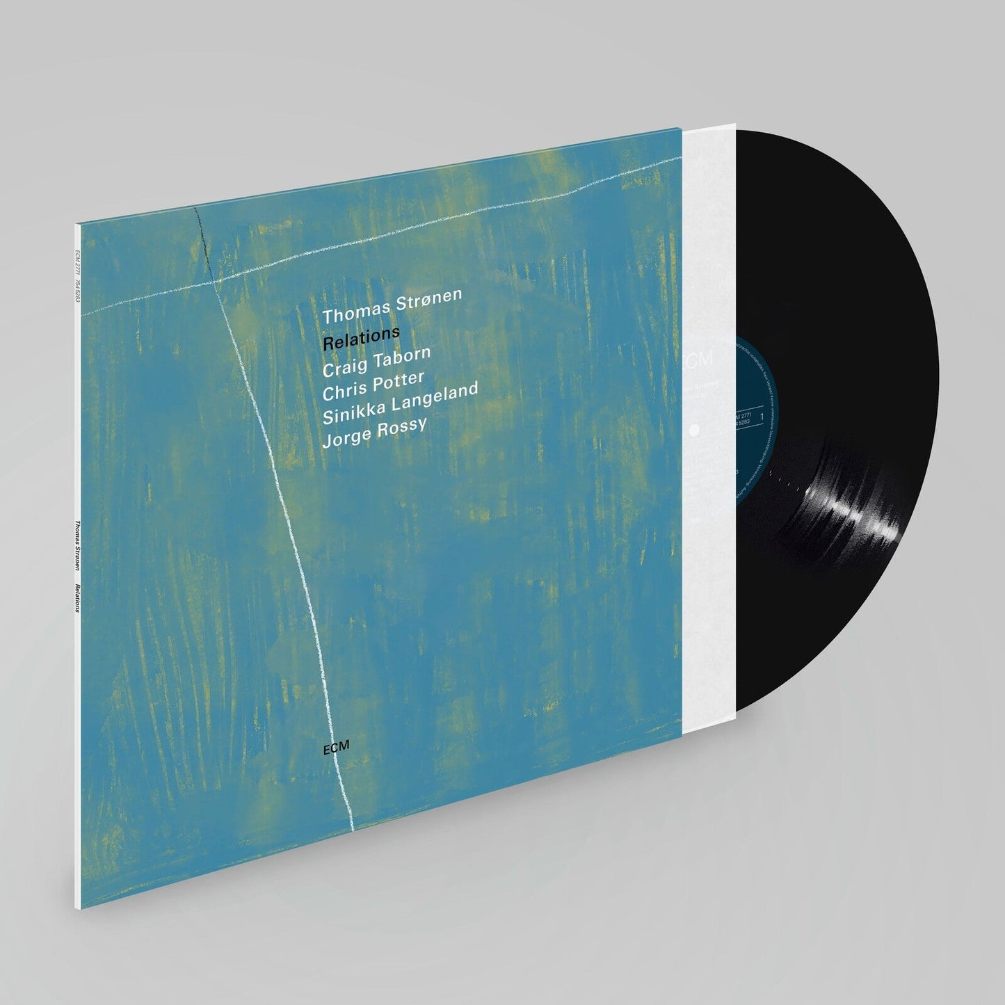 Vinyl record and album cover with abstract blue and yellow design.
