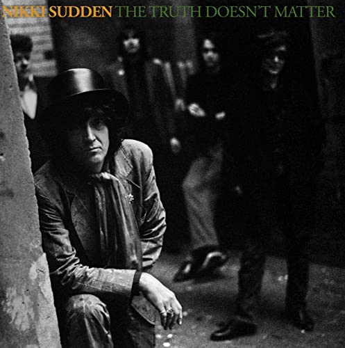 Black and white album cover featuring Nikki Sudden and shadowed figures.