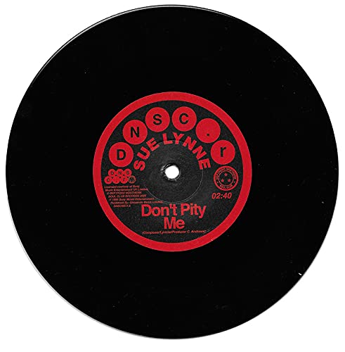 Black vinyl record with red and white "Sue Lynne - Don't Pity Me" label.