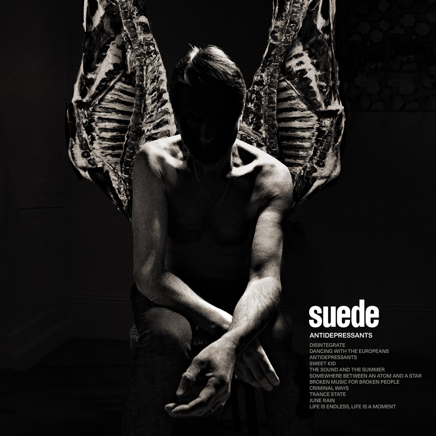 Black and white album cover for Suede’s “Antidepressants” featuring a man with wings.