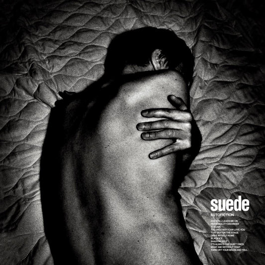Black and white album cover featuring a person with their back to the camera.