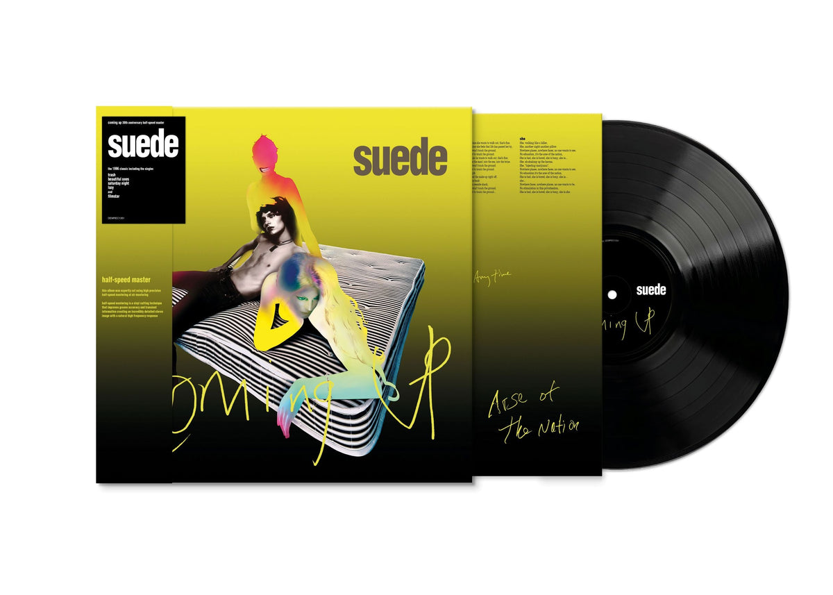 Suede "Coming Up" vinyl record with yellow cover and portrait.
