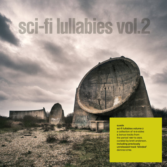 Large concrete sound mirrors in a field under a cloudy sky with text overlay.