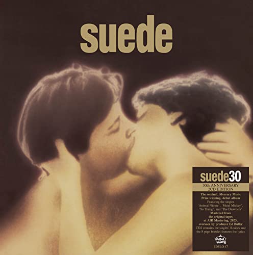 Album cover showing two people kissing with the word Suede and anniversary text overlay.