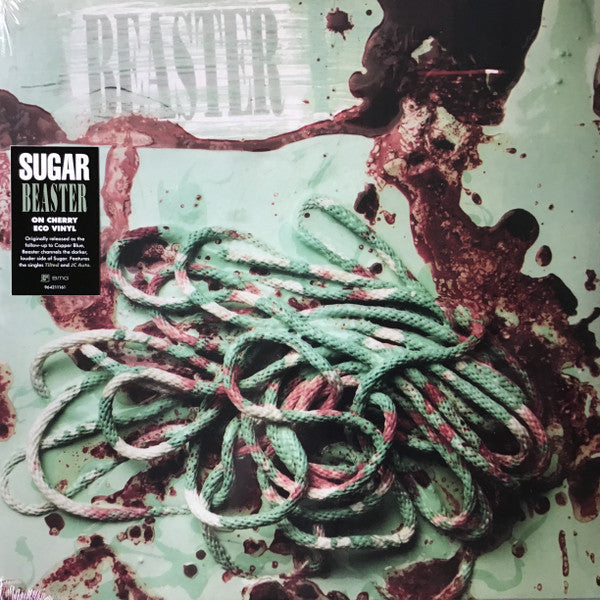 Coiled rope on a light green background with dark red, blood-like splatters.