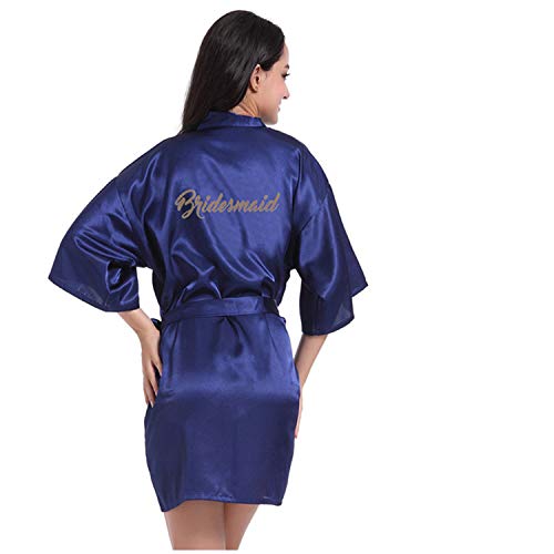 Woman in blue satin robe with bridesmaid written on the back facing away.