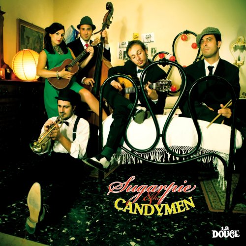 Five musicians in vintage clothing pose around a bed, playing instruments.