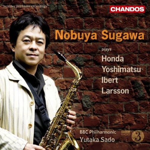 Man holding saxophone stands before a brick wall on a classical music CD cover.