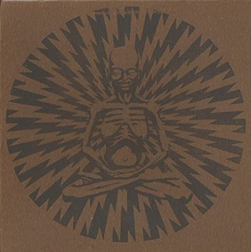 Brown CD case with a stylized illustration of a seated figure.