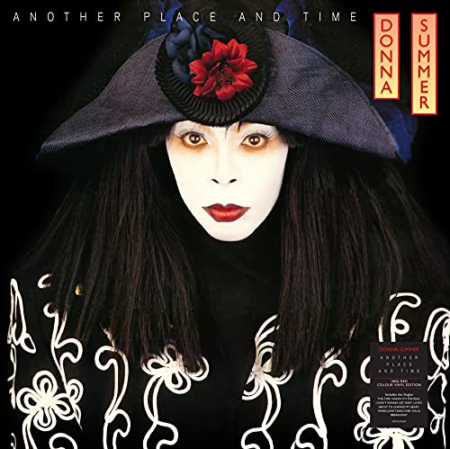 Donna Summer album cover: a woman in a wide-brimmed hat, dark background.