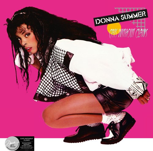 Donna Summer crouches against a pink background on her vinyl album cover.