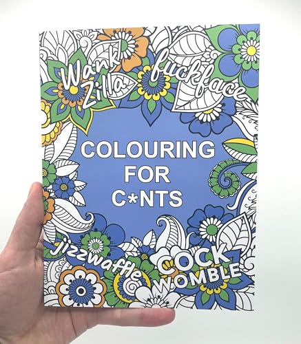 A hand holds a colouring book with floral patterns and offensive text on cover.