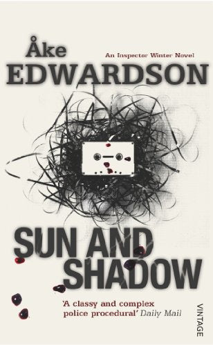 Book cover: "Sun and Shadow" with a cassette tape and tangled lines.