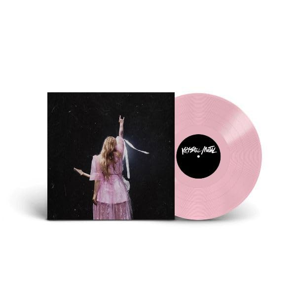 Pink vinyl record with album cover showing a person with raised arm.