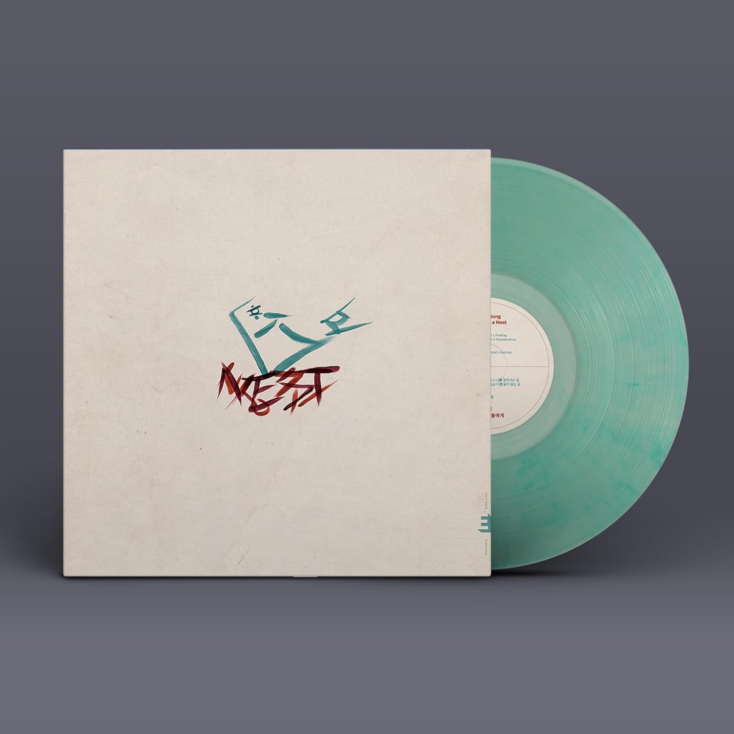 Vinyl record with beige cover featuring red and black calligraphy.