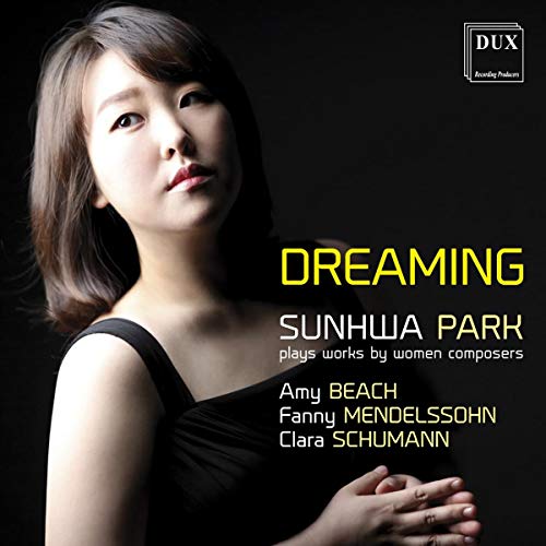 CD cover featuring a woman in black dress against a dark background.