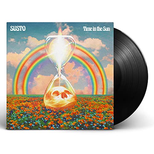 Vinyl record cover featuring an hourglass with a skull in a field under rainbows.