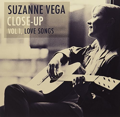 Suzanne Vega album cover: black and white photo of a woman with a guitar.