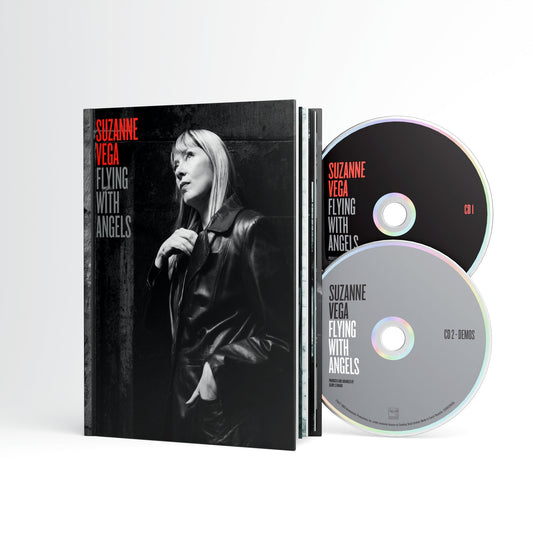 Suzanne Vega “Flying With Angels” CD case and two silver discs.