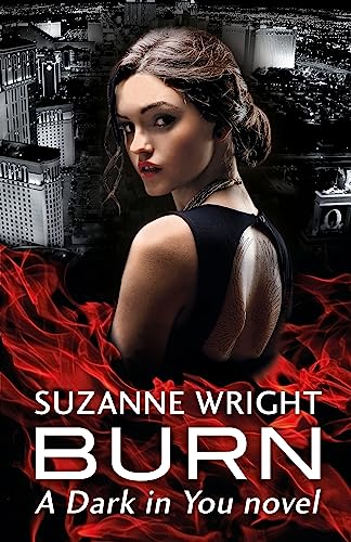 A woman in a black dress stands before a city skyline with red flames below.