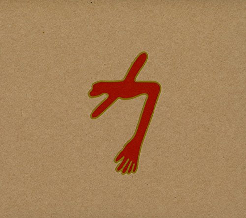 A red abstract figure centered on a textured tan cardboard background.