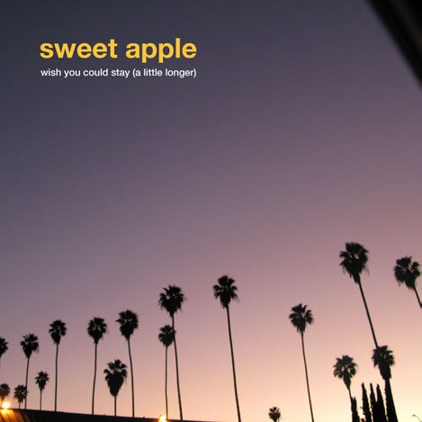 Record cover with palm trees silhouetted against a gradient sunset sky.