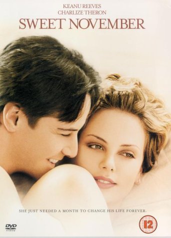 DVD cover featuring Keanu Reeves and Charlize Theron in a close embrace.