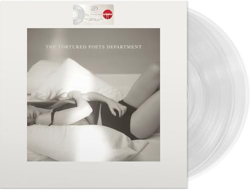 Vinyl record cover showing a person lying on white pillows with clear vinyl discs.