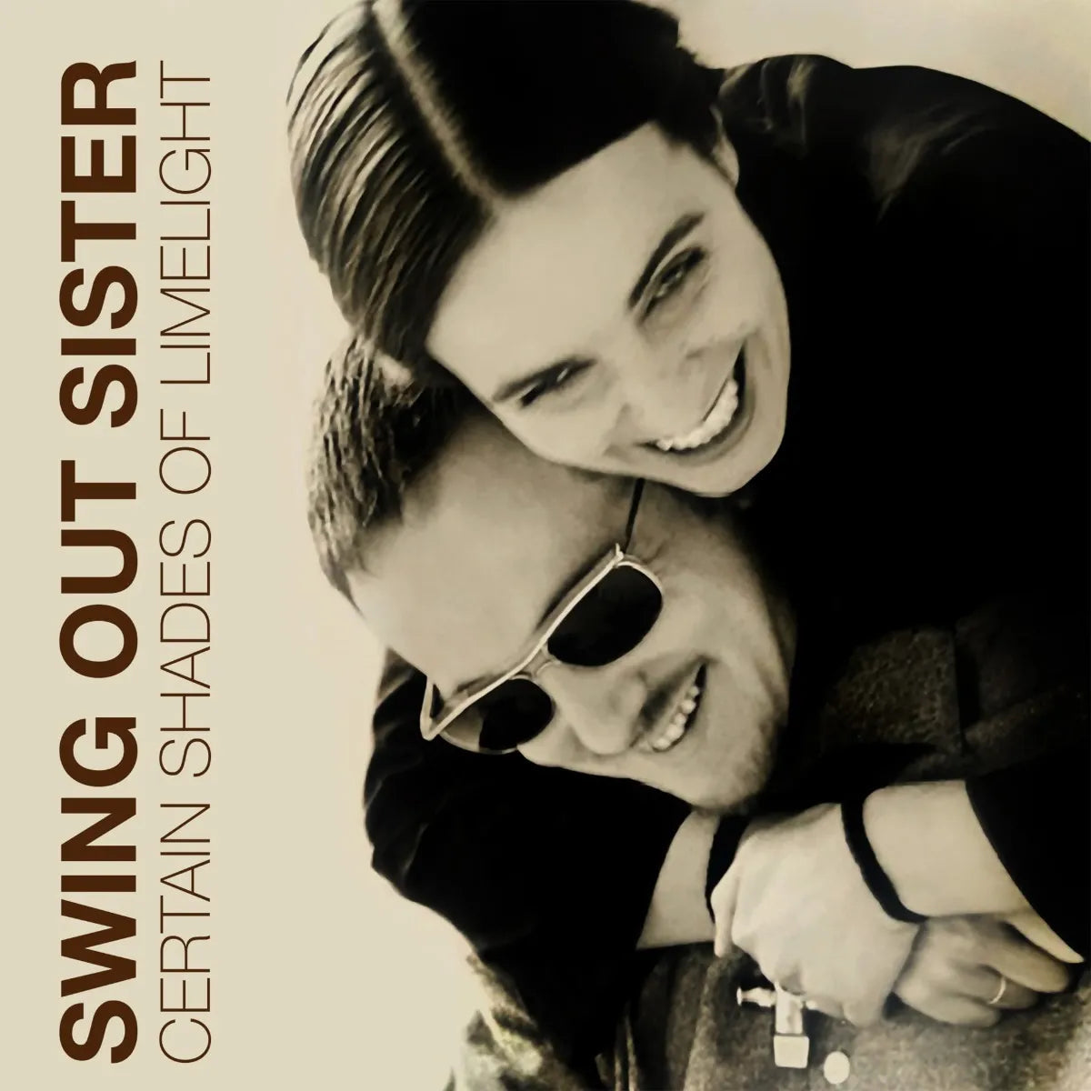 Sepia-toned portrait of two people embracing with text reading Swing Out Sister Certain Shades.