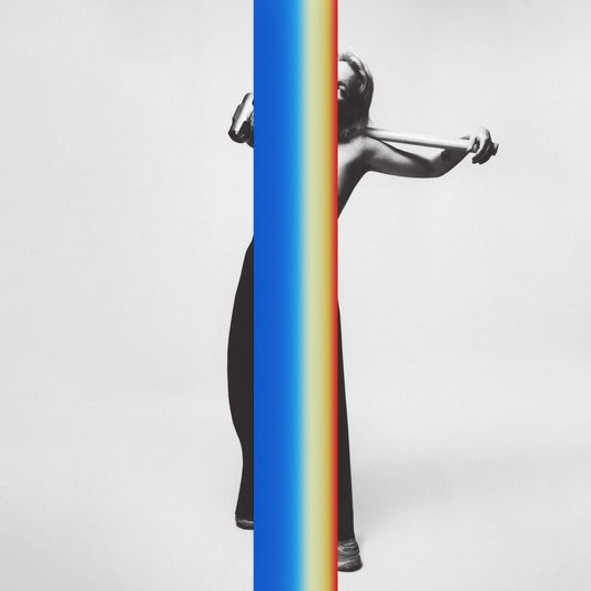 Sylvan Esso album cover: woman with elastic band, split blue and rainbow.