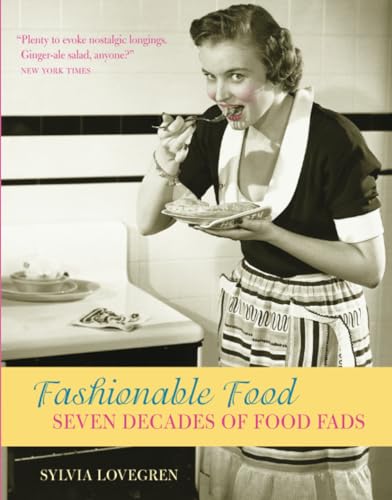 1950s woman with food, book cover titled “Fashionable Food.”