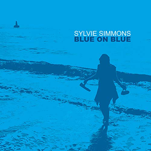 "CD album cover with a blue-toned woman walking on a beach, holding shoes."