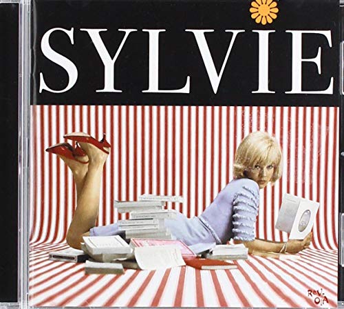 Sylvie Vartan CD cover: woman with books and red shoes.