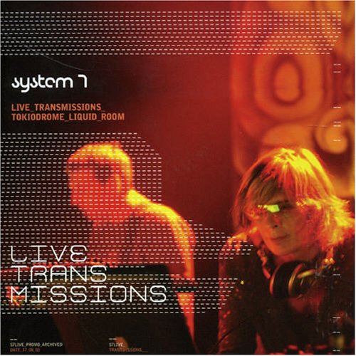 "Album cover with two musicians, pixelated text 'System 7' and 'Live Transmissions' in red and white."