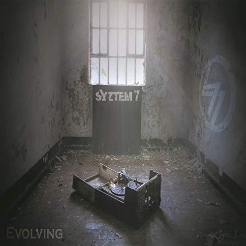 CD cover for “Evolving” by Syztem7, showing a derelict room and a birdcage.