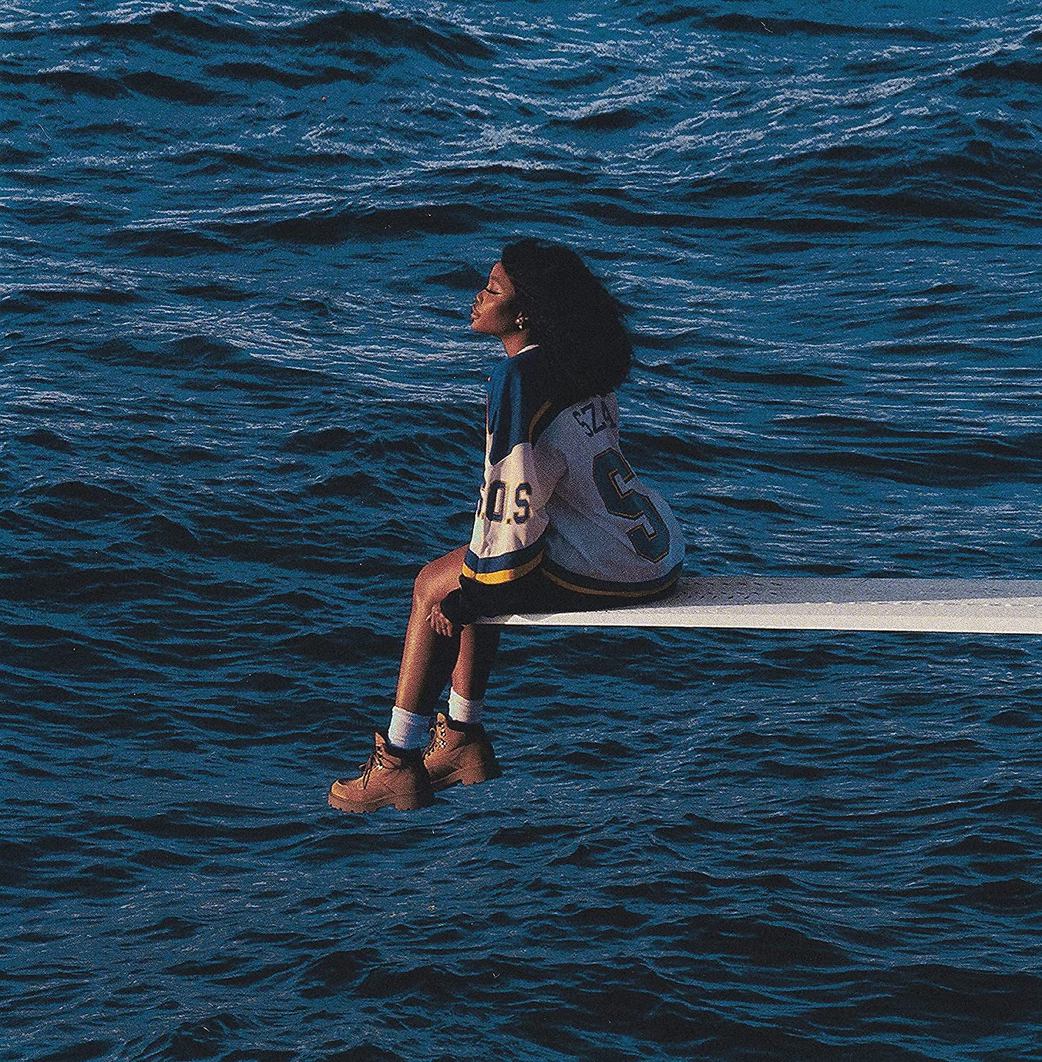 SZA album cover, SOS, showing a person sitting on water.