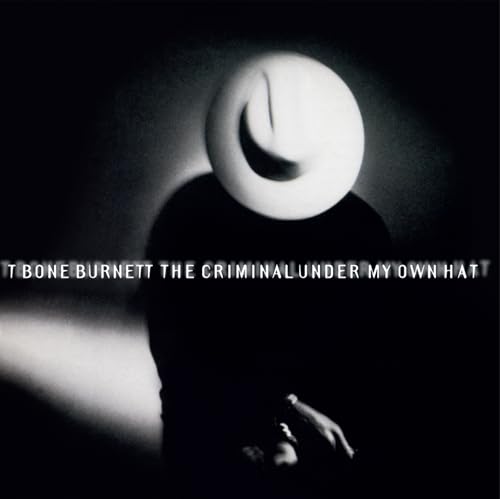 Black and white album cover featuring a man in a hat with text overlay.