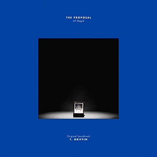Vinyl cover with a blue border, black center, and a small illuminated ring box.