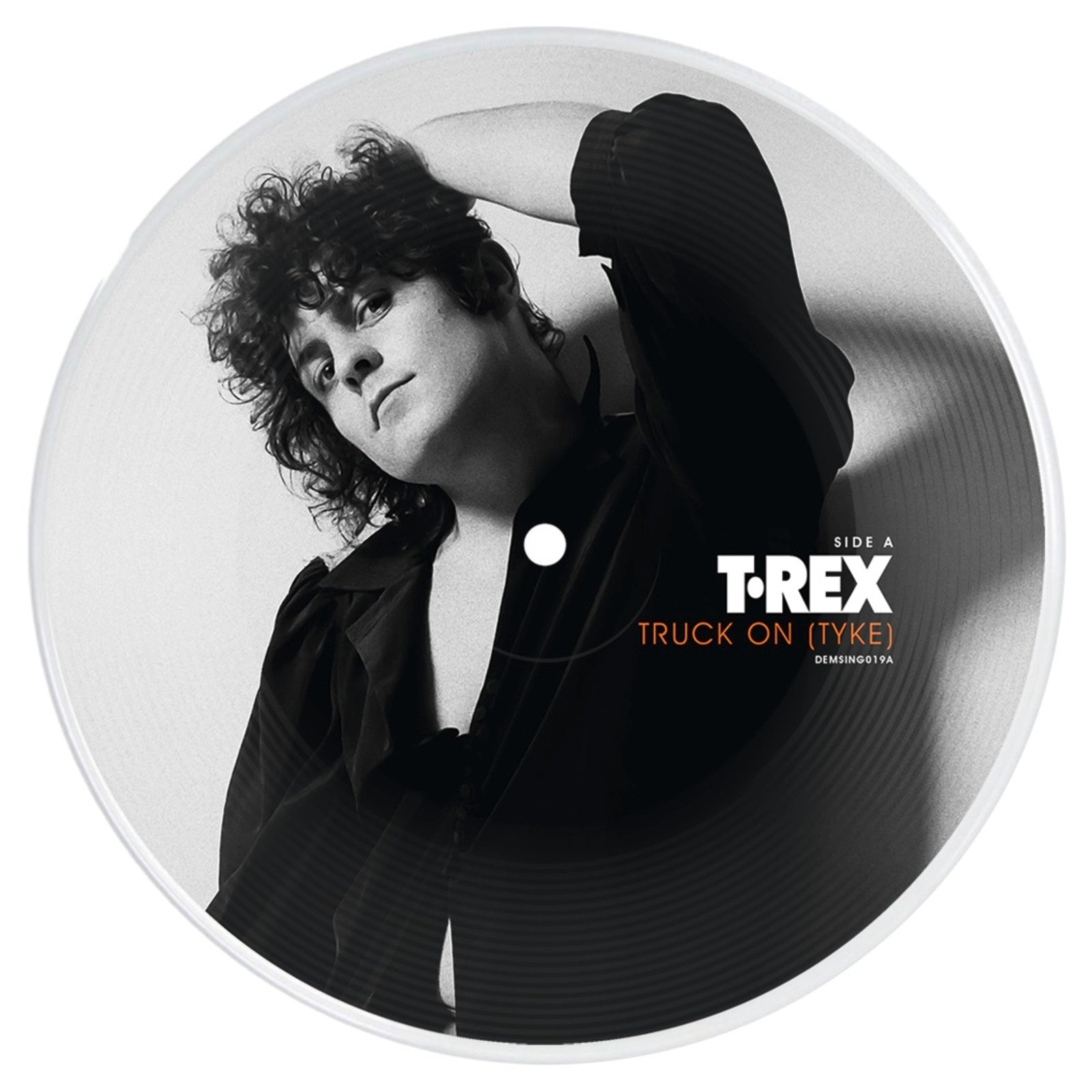 Black and white photo of Marc Bolan on a clear vinyl record.